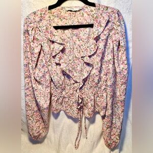 Lush pink floral cropped peasant top with a double tie front and ruffles